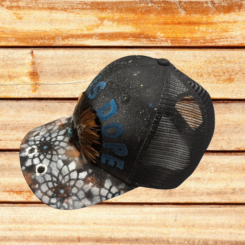 Black Hat with Feather and "God Is Dope" saying and Spray Painted flowers on bill