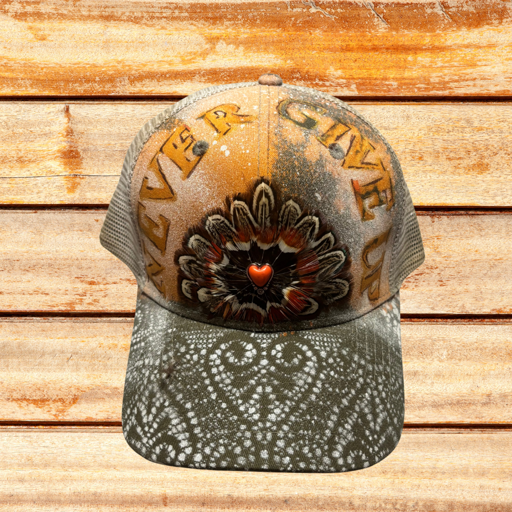 Green And Beige Trucker at with "Never Give Up" saying w feathers