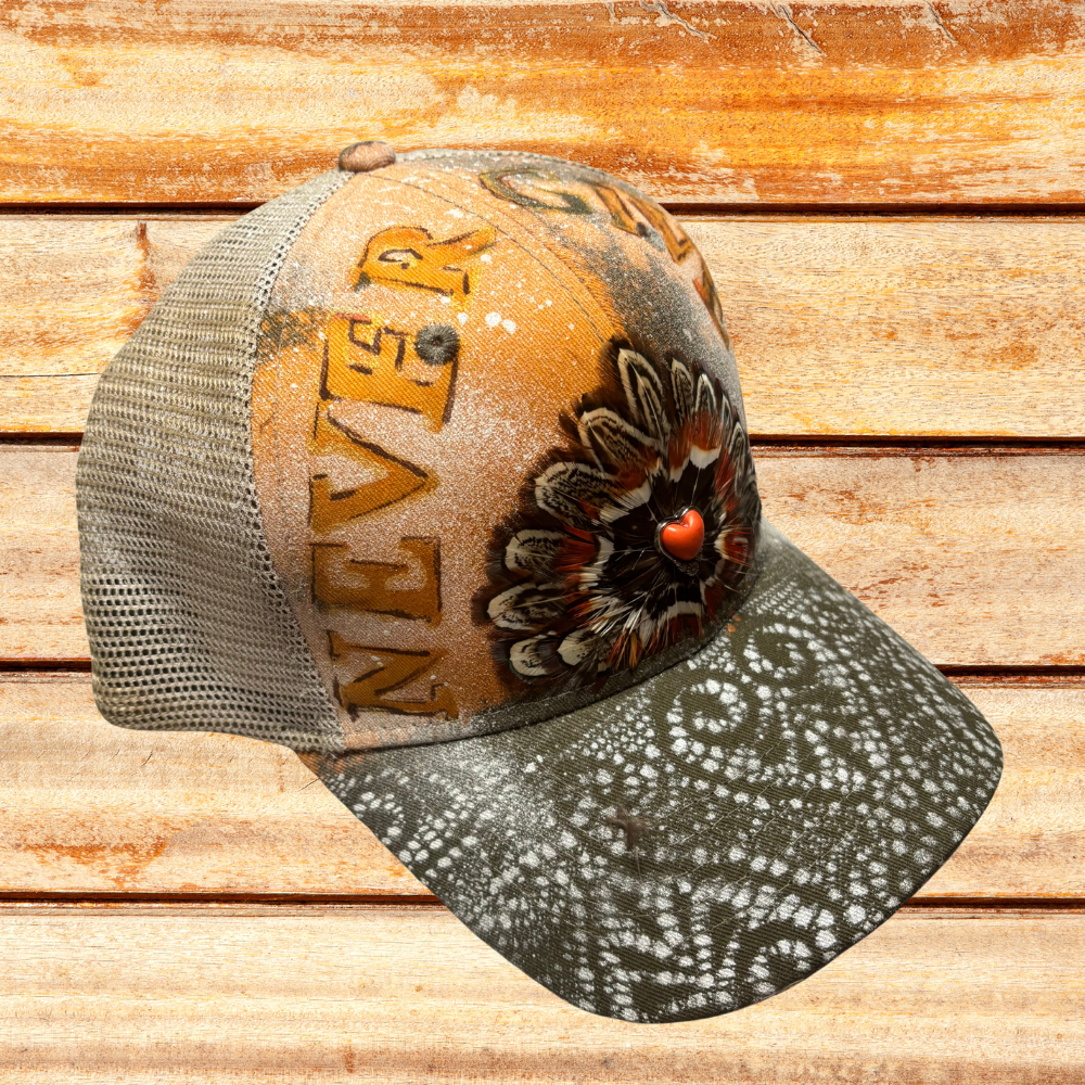 Green And Beige Trucker at with "Never Give Up" saying w feathers